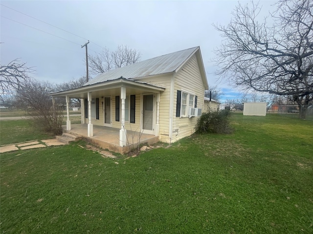 view of front of house with a porch and a front lawn