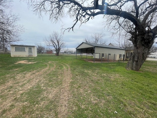 view of yard with a carport