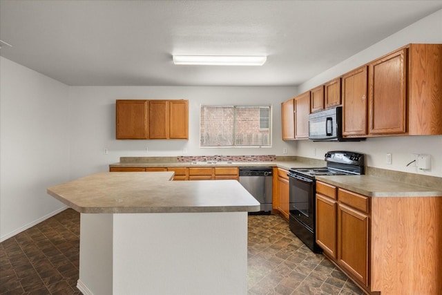 kitchen featuring dark tile flooring, black appliances, and sink