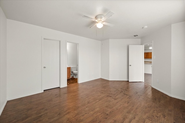 unfurnished room featuring dark hardwood / wood-style floors and ceiling fan