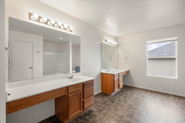 bathroom with double sink, vanity with extensive cabinet space, and tile flooring