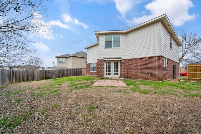 back of house with a yard