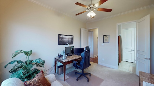 carpeted office space featuring ceiling fan and ornamental molding