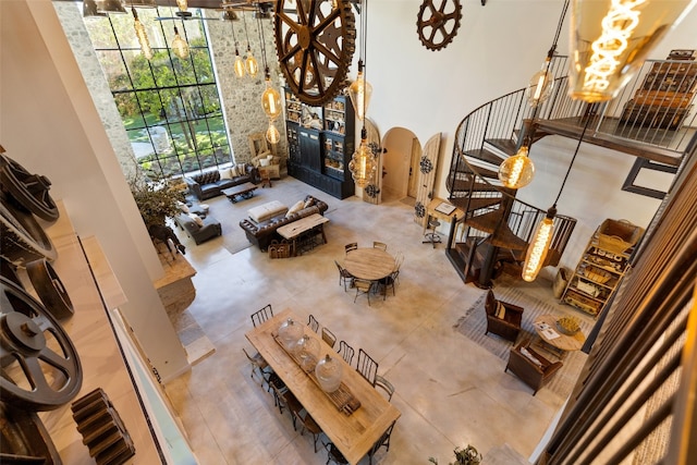 tiled living room with a high ceiling