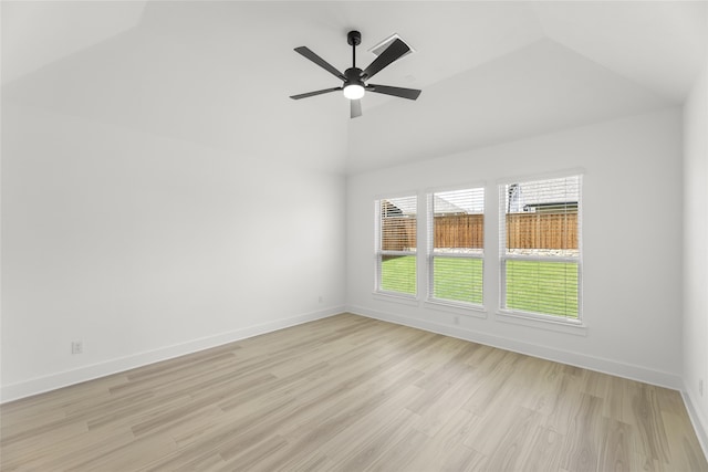 spare room featuring light hardwood / wood-style floors, ceiling fan, and vaulted ceiling