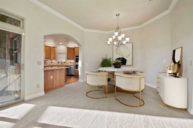 dining room with a notable chandelier, crown molding, and light carpet