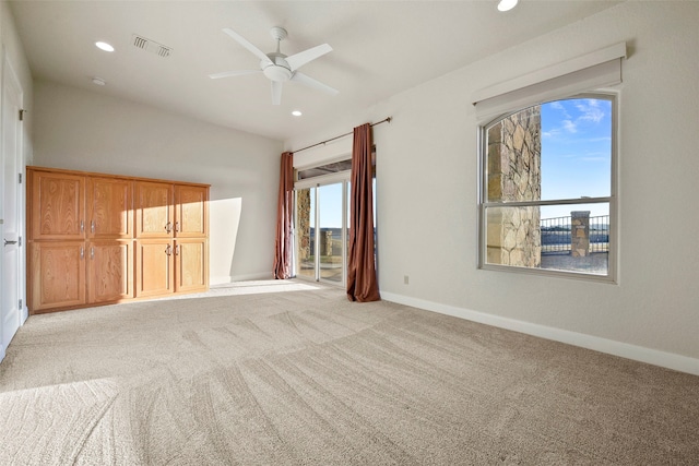 interior space with light carpet and ceiling fan