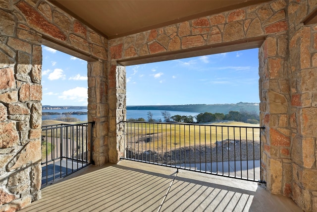 balcony featuring a water view