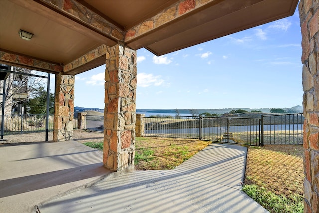 view of patio / terrace featuring a water view