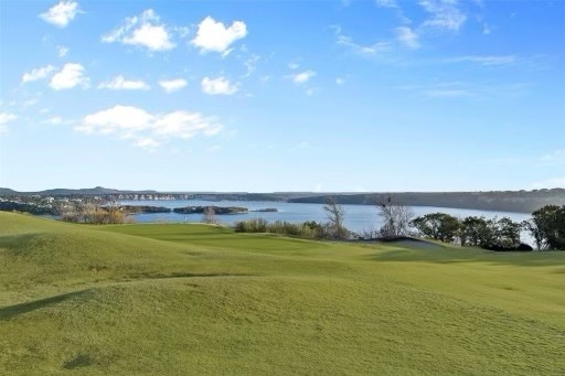 surrounding community featuring a water view