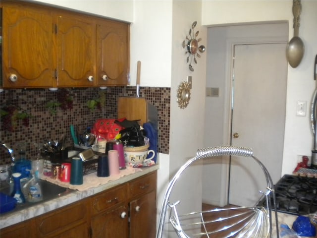 kitchen featuring sink and backsplash