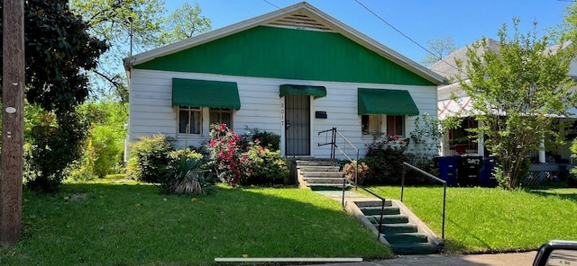 bungalow-style house with a front lawn