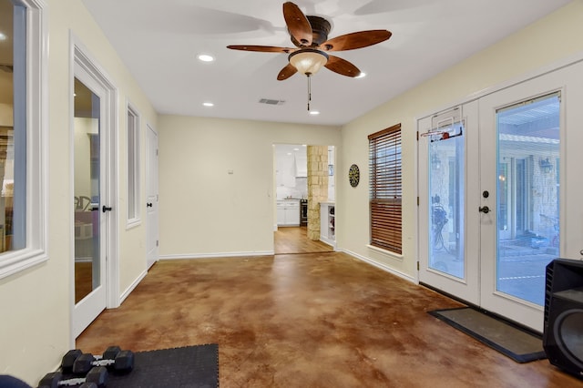 interior space with french doors, carpet floors, and ceiling fan