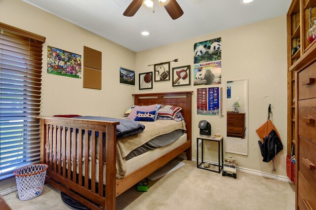 carpeted bedroom featuring ceiling fan