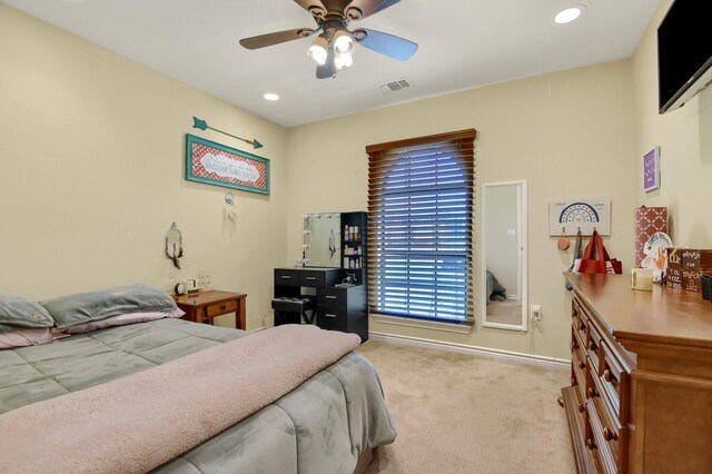 bedroom with ceiling fan and light colored carpet