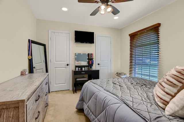 carpeted bedroom featuring ceiling fan