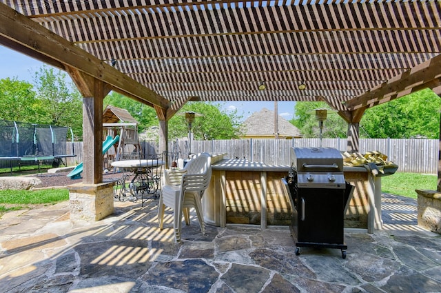 view of patio / terrace featuring a playground, a pergola, a trampoline, and grilling area