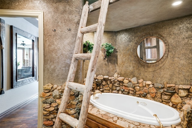 bathroom featuring a bathing tub and hardwood / wood-style floors