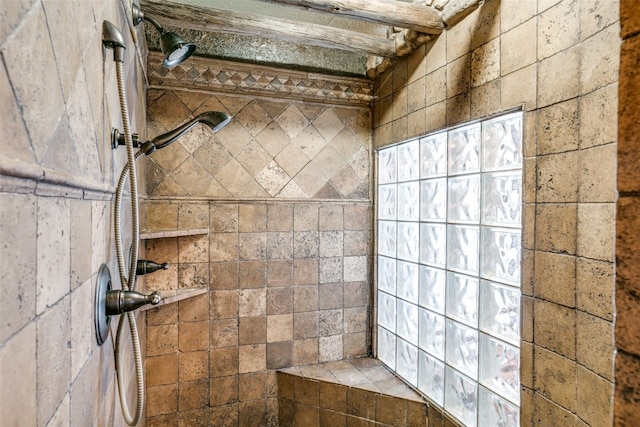 bathroom with tiled shower