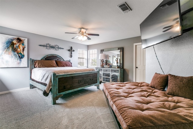 bedroom featuring ceiling fan and light colored carpet