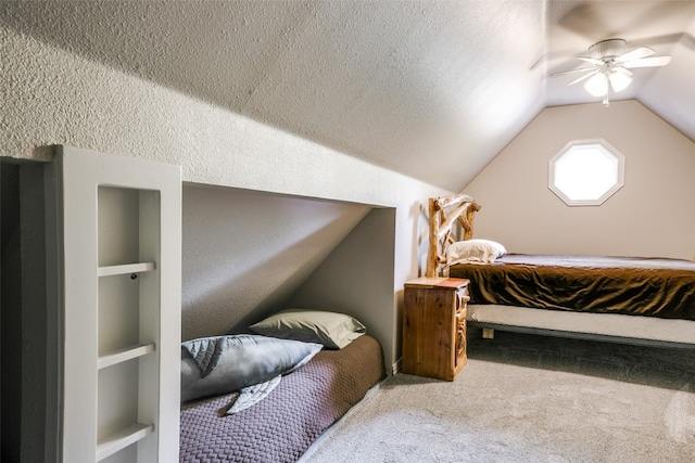 carpeted bedroom with lofted ceiling, ceiling fan, and a textured ceiling