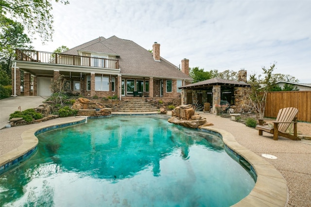 view of swimming pool featuring a patio area