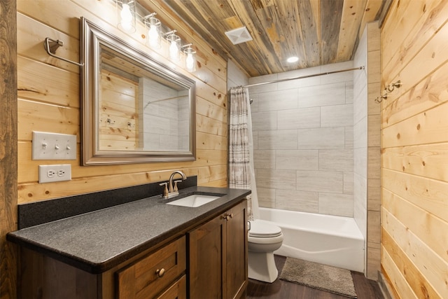 full bathroom with toilet, wooden walls, wooden ceiling, wood-type flooring, and vanity