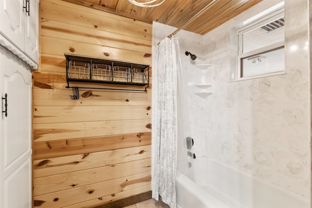 bathroom with wooden ceiling, wood walls, and shower / bath combo with shower curtain