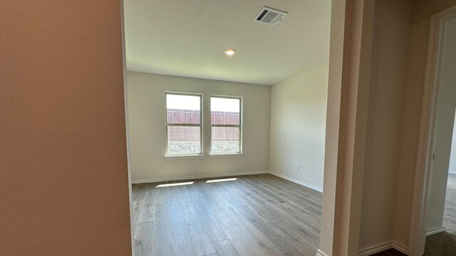 empty room featuring hardwood / wood-style floors