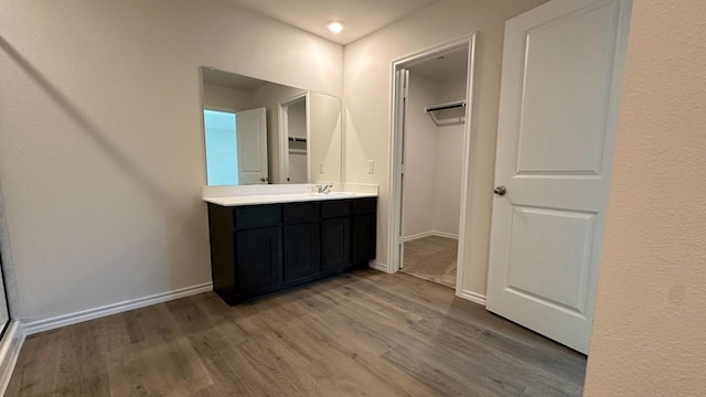 bathroom featuring vanity and hardwood / wood-style flooring