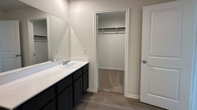 bathroom with vanity and hardwood / wood-style floors