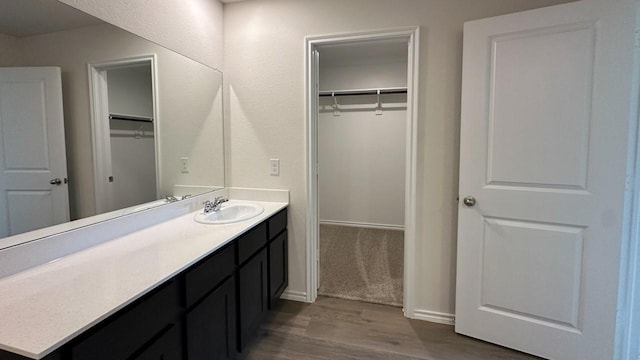 bathroom featuring vanity and wood-type flooring