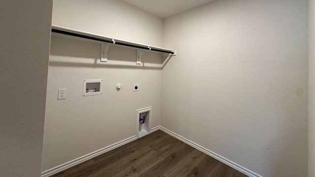 washroom with hookup for a gas dryer, dark hardwood / wood-style flooring, electric dryer hookup, and washer hookup