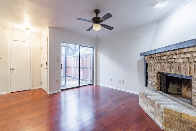 unfurnished living room with hardwood / wood-style floors, a brick fireplace, ceiling fan, and ornamental molding