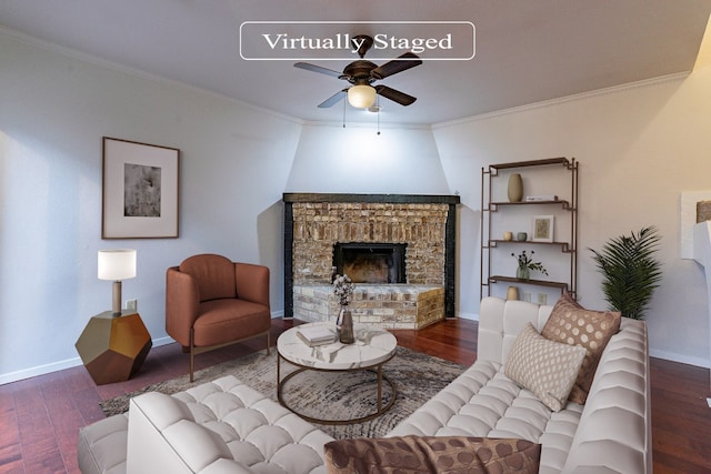 living room featuring ceiling fan, dark wood-type flooring, crown molding, and a brick fireplace