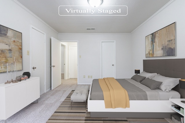 bedroom featuring carpet floors and crown molding