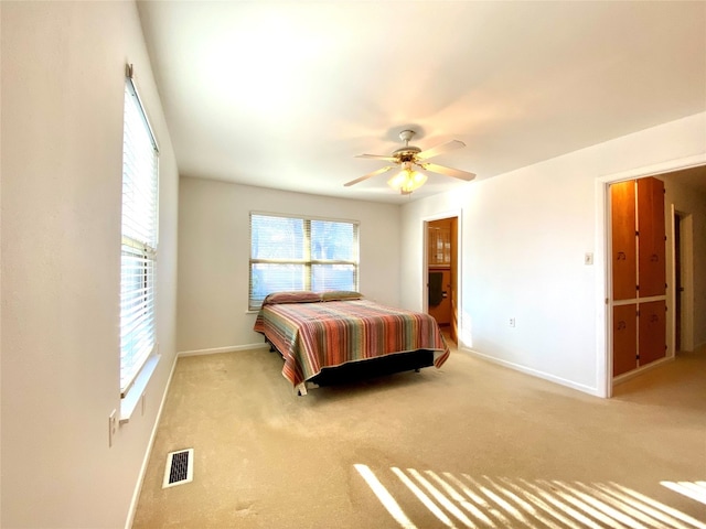 carpeted bedroom featuring ceiling fan