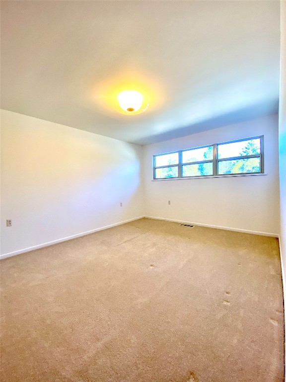 empty room with light carpet