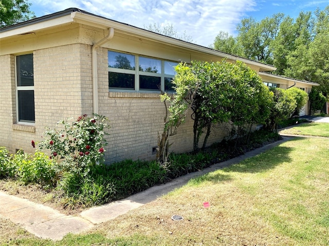 view of home's exterior featuring a yard