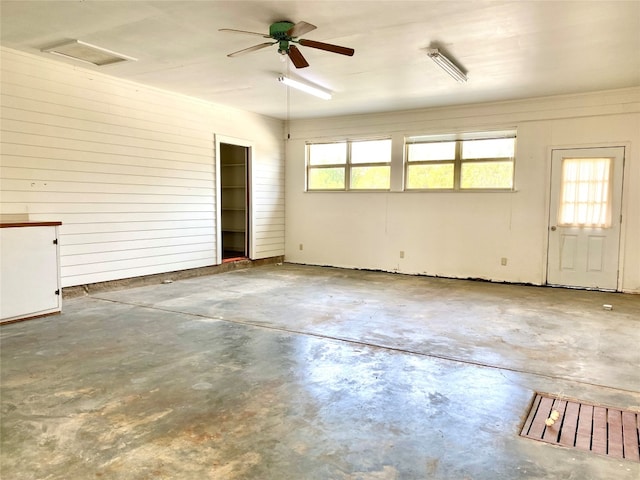 interior space featuring ceiling fan