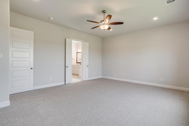 unfurnished bedroom featuring recessed lighting, baseboards, visible vents, and light colored carpet