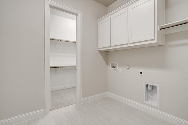 laundry area featuring cabinets, electric dryer hookup, washer hookup, and gas dryer hookup