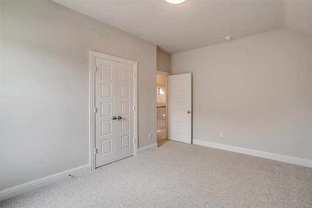 unfurnished bedroom featuring a closet and carpet flooring