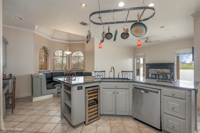 kitchen with dark stone counters, wine cooler, dishwasher, sink, and gray cabinets