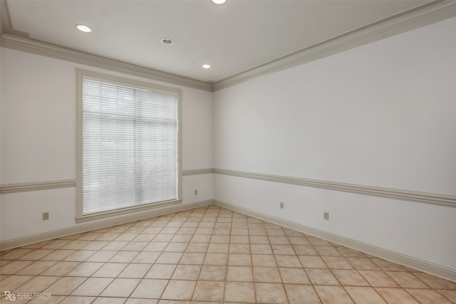 unfurnished room featuring light tile floors and crown molding