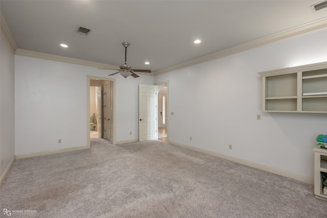 carpeted empty room with ornamental molding and ceiling fan