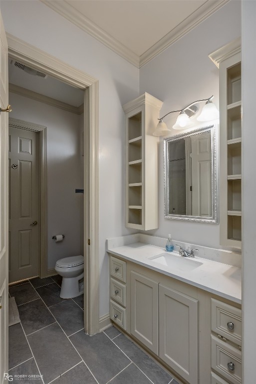 bathroom with tile flooring, toilet, ornamental molding, and vanity