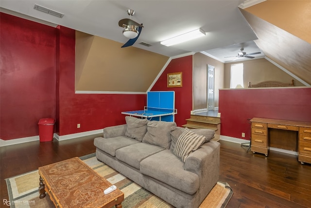 living room with lofted ceiling, ceiling fan, dark hardwood / wood-style floors, and crown molding