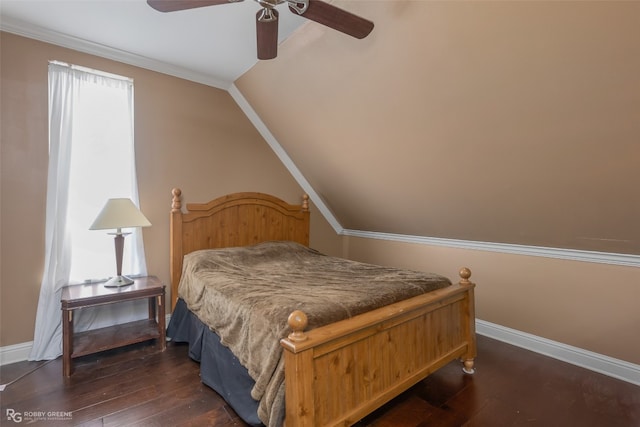 bedroom featuring ceiling fan, ornamental molding, dark hardwood / wood-style floors, and vaulted ceiling