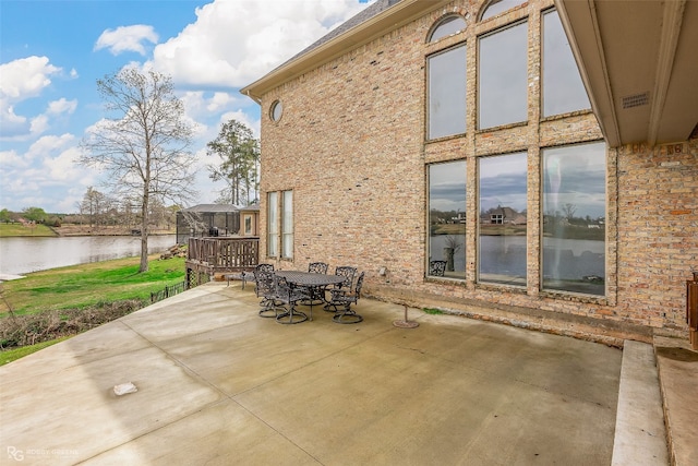 view of terrace featuring a water view